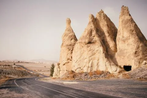 Empty road through mountain valley in Cappadocia, Turkey Stock Photos
