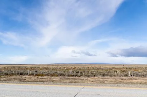 Empty road under blue sky in Patagonia, Chile Stock Photos