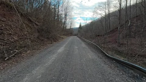 Empty road winds through autumn woods. Grza River Spring, Serbia Видео 332374092