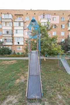 Empty rocket slide on an old Soviet playground. Stock Photos