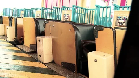 Empty roller coaster carts exit station  Video stock 108061130