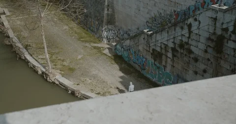 Empty Rome Italy - man jogging on banks of River Tiber Covid19 Stock Footage 127669915