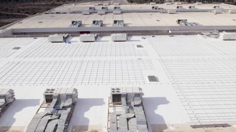 Empty rooftop solar farm bases slide aerial Stock Footage 331717489