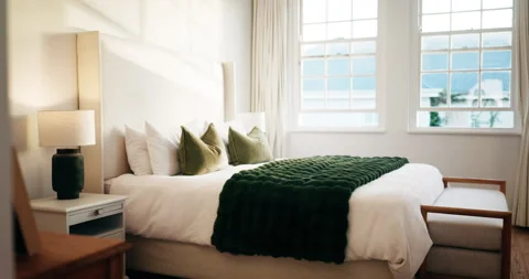 Empty, room and bed in hotel, interior design and furniture with decor, real Stock Footage 338223713