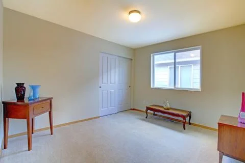 Empty room with antique bench and cabinet Stock Photos