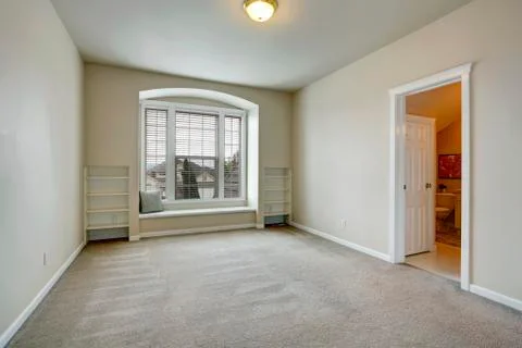 Empty room with arch window and bench Stock Photos