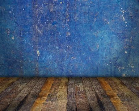 Empty room with blue grunge wall and wooden floor Stock Photos