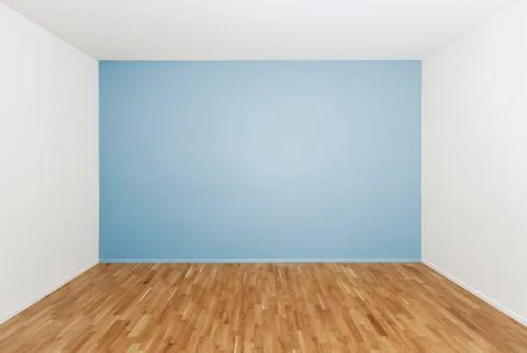 Empty room with a blue wall Stock-Fotos