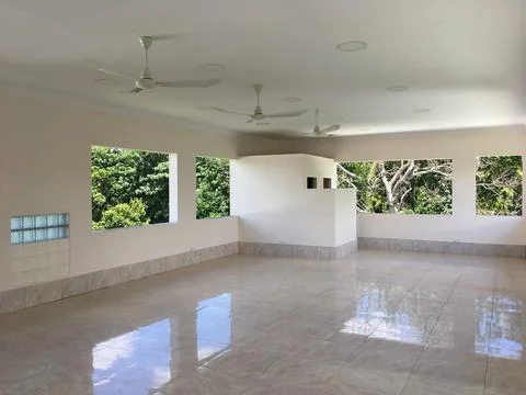 Empty room with ceiling fans 스톡 사진
