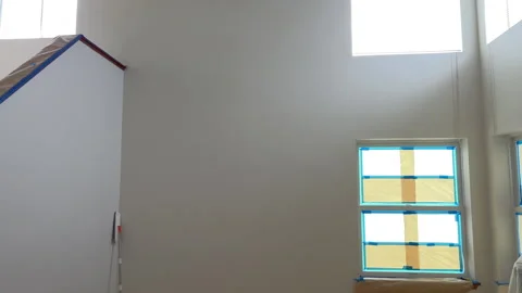 Empty room with covered windows before remodel Stock Footage 344935759