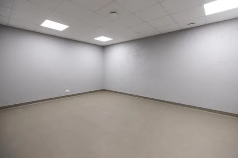 Empty Room with Gray Walls and White Acoustic Tile Ceiling Stock Photos