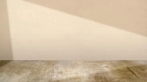 Empty room interior with a rustic wooden floor and beige textured wall, hig.. Stock Photos
