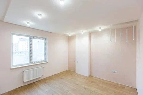 Empty room with large window and wooden floor in house Stock Photos