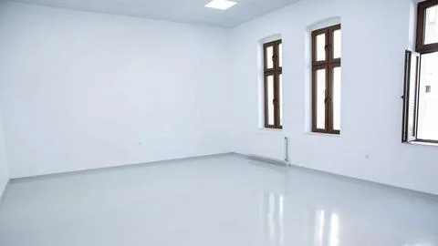 Empty Room with Large Windows and Polished Floor Stock Photos
