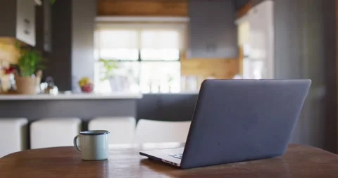Empty room in log cabin with laptop and mug on table, slow motion Stock Footage 230730874