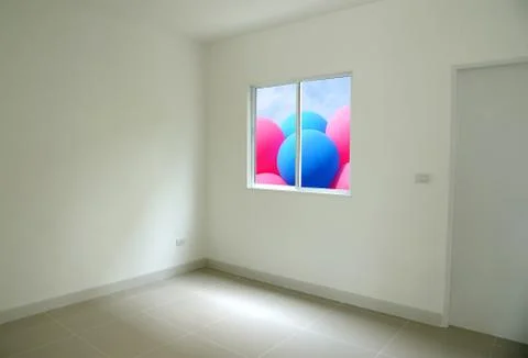 Empty room with opened window colorful balloon outside. Stock-Fotos
