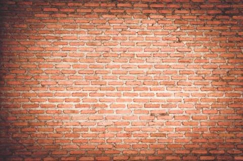 Empty room with red brick wall and wooden floor Stock Photos
