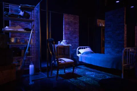 Empty room in retro style in dark colors with old bed and furniture Foto stock