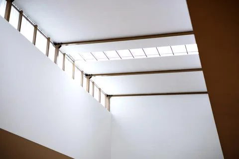 An Empty Room With Skylights On The Top Stock Photos