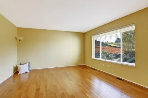 Empty room in soft ivory with new hardwood floor Stock Photos