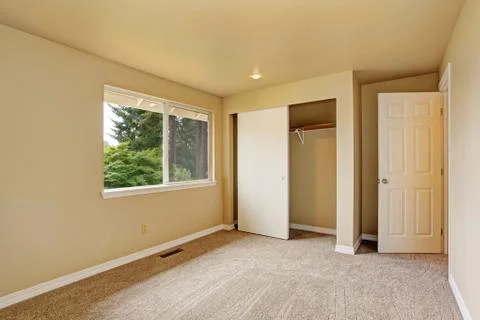 Empty room in soft ivory tones with closet Stock Photos