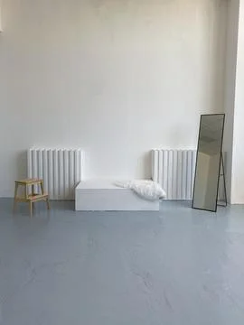 Empty room with stool bed and mirror natural light Stock Photos