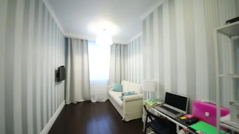 Empty room for teenager with sofa, table, laptop, shelves in apartment Stock Footage 276364299
