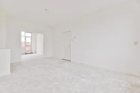 Empty room with window and radiator Stock Photos