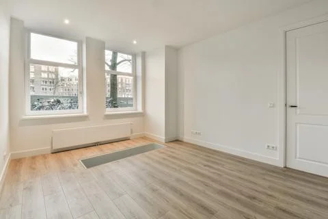 Empty room with window and radiator Stock Photos