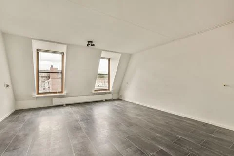 Empty room with window and radiator Stock Photos