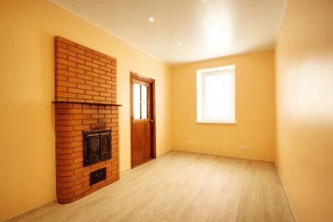 Empty room with window and turned on lights on the ceiling Stock Photos