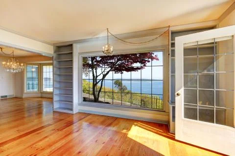 Empty rooms with water view and large windows. Stock Photos