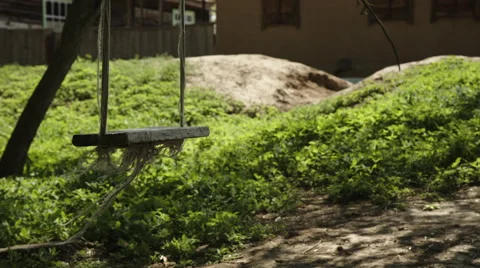 Empty rope swing swaying in the wind Stock Footage 63223425