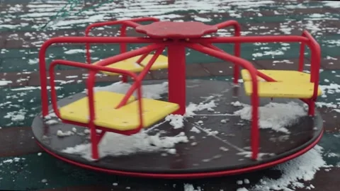 Empty rotating carousel during a pandemic on closed kindergarten playground. Stock Footage 146734246