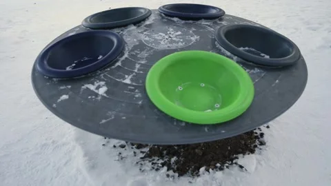 Empty Rotating round Carousel on the Playground in winter. Coronavirus Stock Footage 146462412