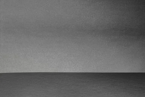 Empty rough gray studio space with deep shadows Stock Photos