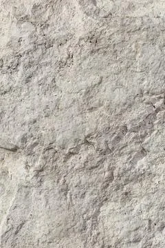 Empty rough, uneven texture of a gray concrete wall close up with copy space Stock Photos