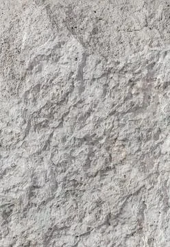Empty rough, uneven texture of a gray concrete wall close up with copy space Stock Photos