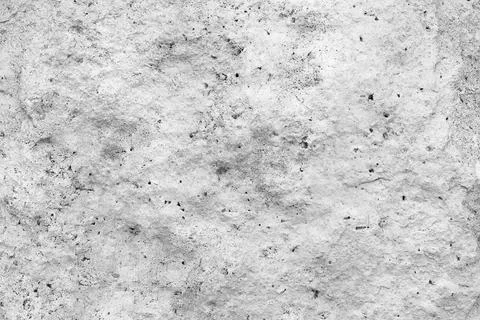 Empty rough, uneven texture of a gray concrete wall close up with copy space. Stock Photos