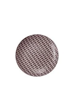 An empty round ceramic plate on a dark, textured brown background. An empty r Stock Photos