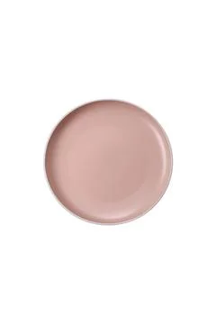 An empty round ceramic plate on a dark, textured brown background. An empty r Stock Photos