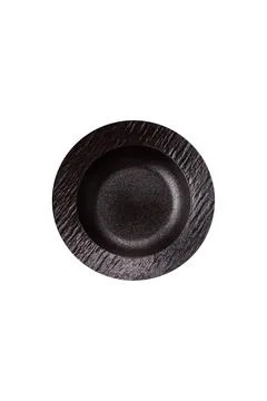 An empty round ceramic plate on a dark, textured brown background. An empty r Stock Photos