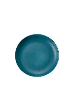 An empty round ceramic plate on a dark, textured brown background. An empty r Stock Photos