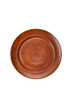 An empty round ceramic plate on a dark, textured brown background. An empty r Stock Photos
