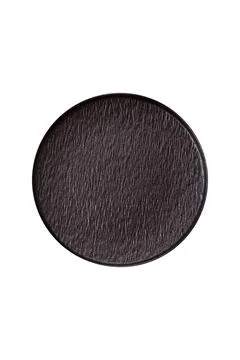 An empty round ceramic plate on a dark, textured brown background. An empty r Stock Photos