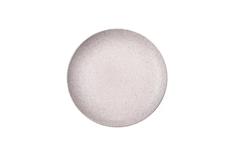 An empty round ceramic plate on a dark, textured white background. An empty r Stock Photos