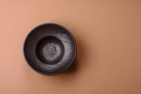 An empty round ceramic plate on a table, kitchenware. An empty plate Stock Photos
