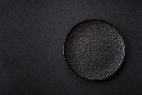 An empty round ceramic plate on a table, kitchenware. An empty plate Stock Photos