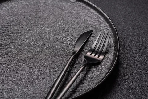 An empty round ceramic plate on a table, kitchenware. An empty plate Stock Photos