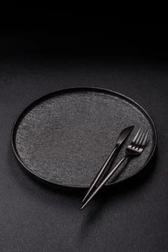 An empty round ceramic plate on a table, kitchenware. An empty plate Stock Photos